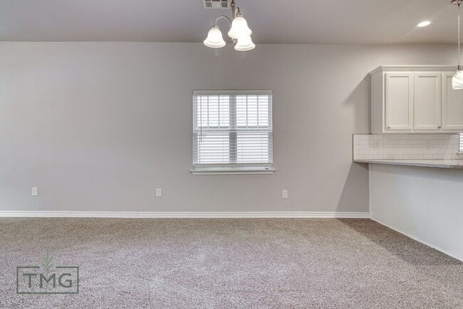 Building Photo - Spacious 3/2 with Front Porch, Fenced Yard...