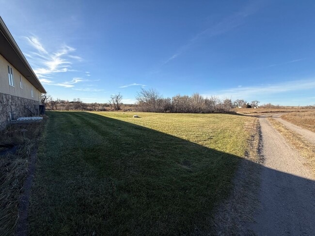 Building Photo - Spacious, four-bedroom, two-bathroom, coun...