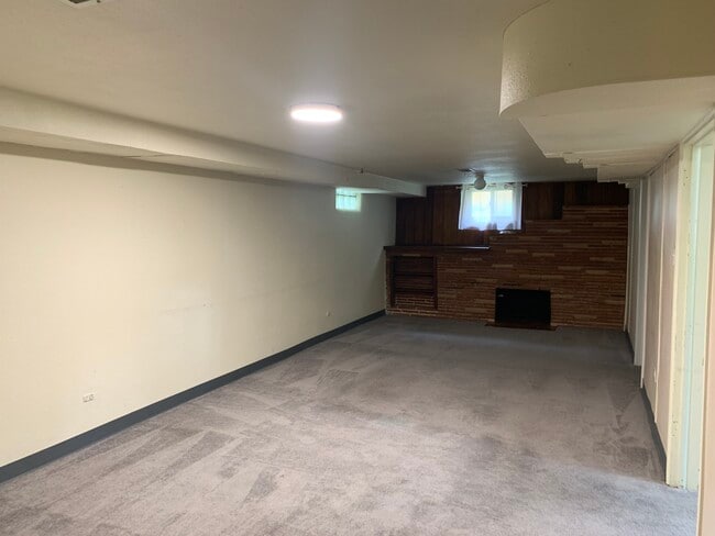 Large family room in basement - 3010 S Downing St