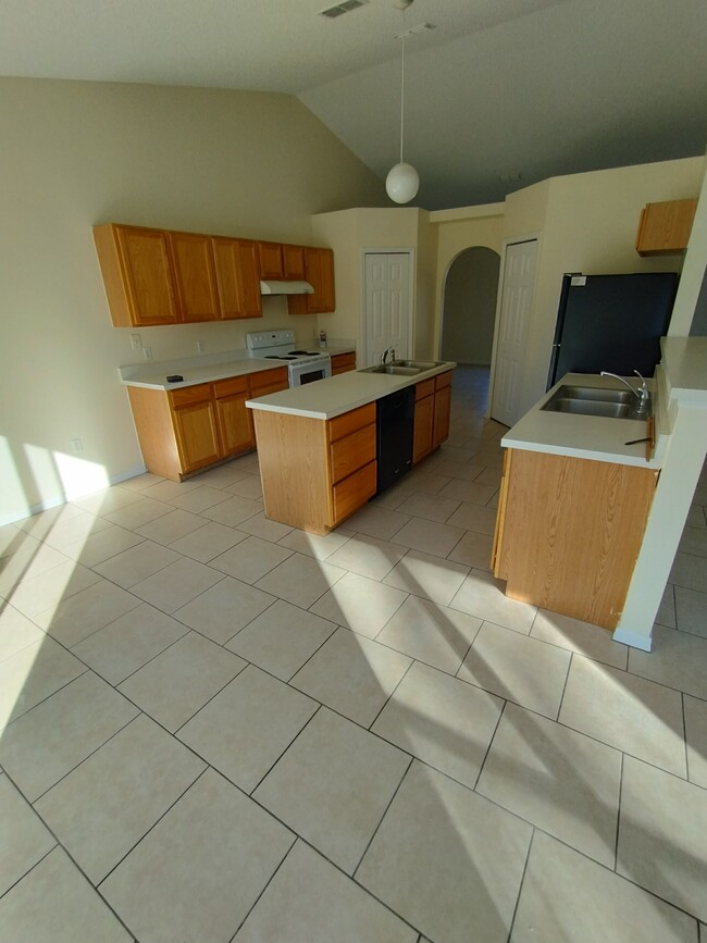 Open kitchen with island - 2250 Macedo Rd NE