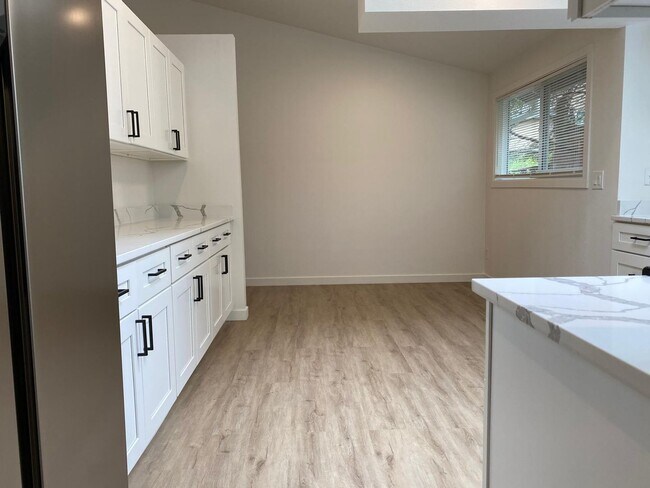 Building Photo - Stylishly Renovated Home with Private Back...