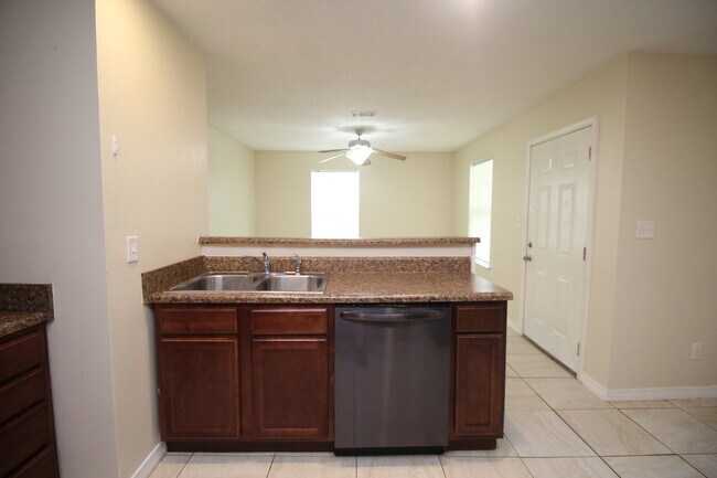 Building Photo - West Pensacola Duplex Living — 3BR Home with Open Floor Plan, Eat-In Kitchen, Covered Patio & Low...