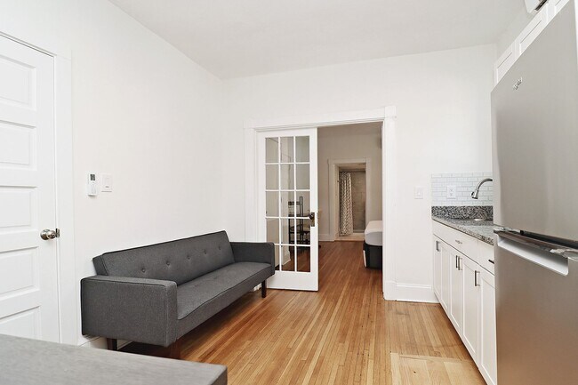 Building Photo - Furnished, Light-Filled Apartment With Utilities Included