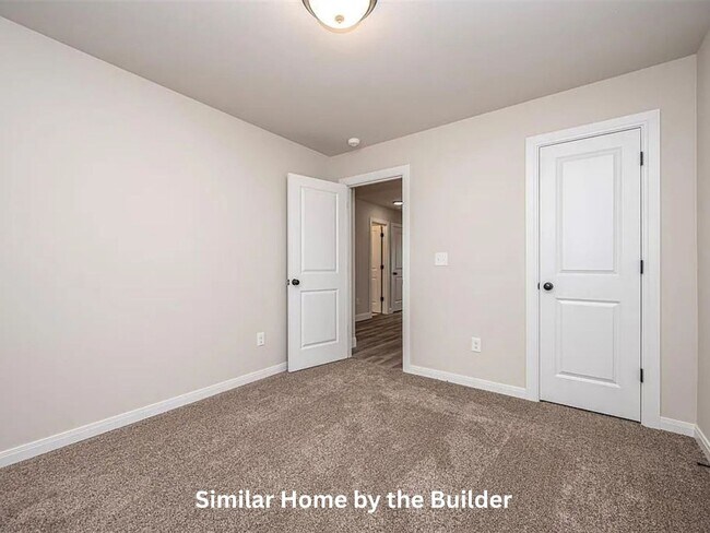 Building Photo - Spacious 4-Bedroom Home with 3-Car Garage in Yukon!
