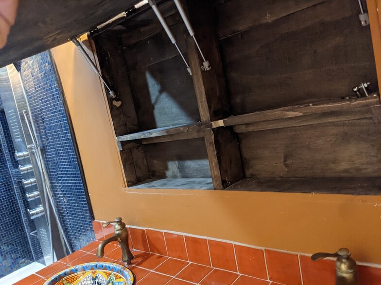 Master bathroom hidden storage behind mirror - 2854 S Meade St