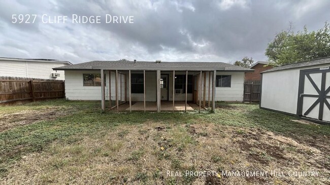 Building Photo - Three bedroom home with covered patio