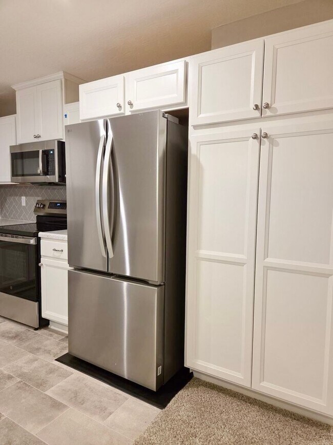 Building Photo - Exquisite just built condo with everything! Ground floor, no stairs, attached garage