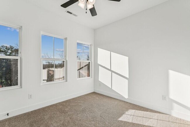 Building Photo - High-End 2BR Townhome | Rooftop Terrace + 2-Car Garage | 24-Unit Community