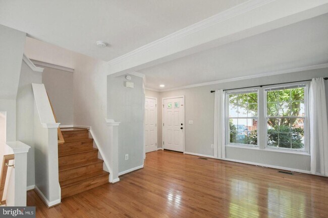 Building Photo - Amazing, updated end unit townhome backing to trees and open common area in Centre Ridge neighbor...
