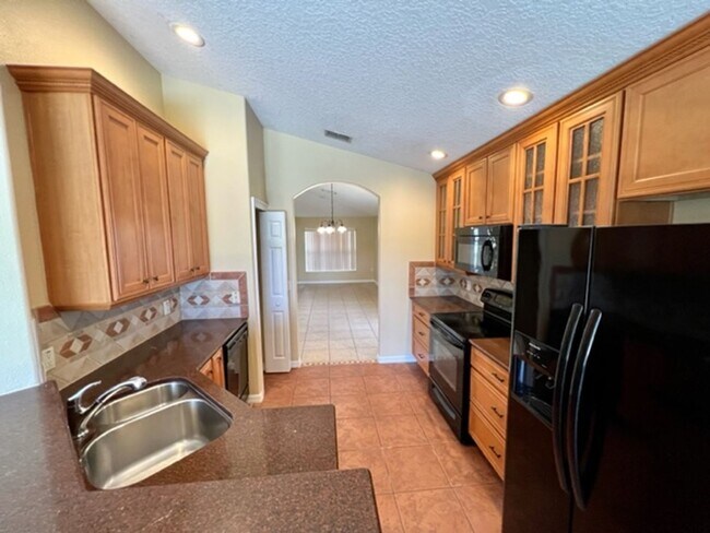 Building Photo - EAGLE CREEK LAKE NONA! WELCOME HOME! Beautiful water views! Spacious 2 story-3 bedroom 2.5 bath h...