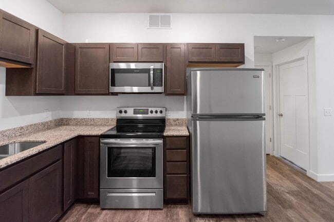Building Photo - Up to one month free! 1-Bedroom Condos at ...