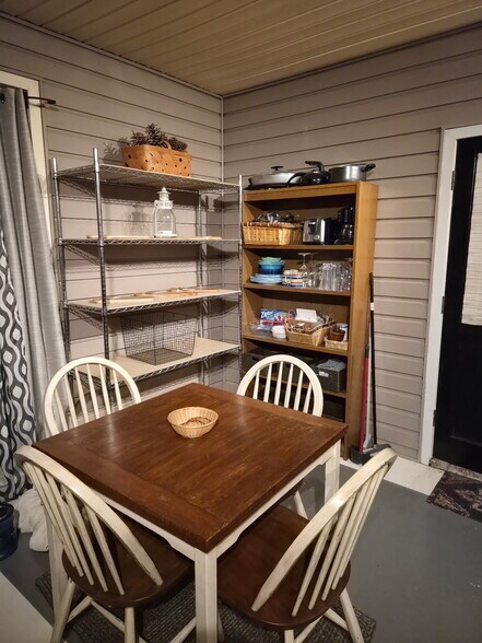 Dinette with four chairs. The table extends. Plates, cups and flatware available.Plenty of shelves a - 7 Canterbury Ct SE
