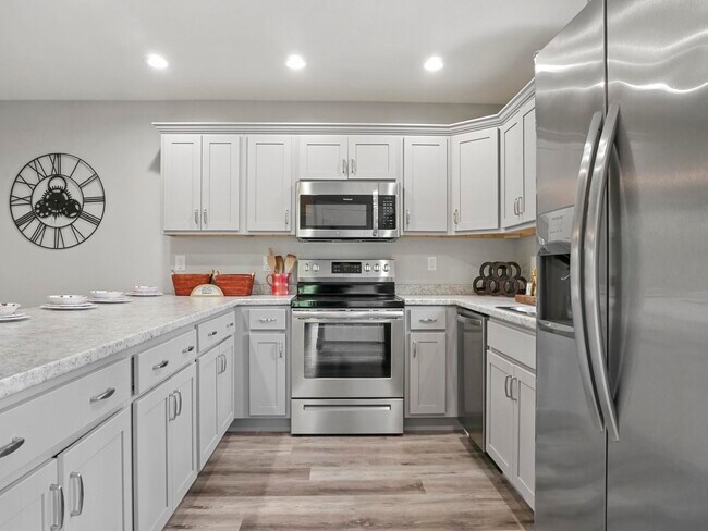 Kitchen has plenty of storage and a large eat on bar area - 105 Bobby Ridge Dr