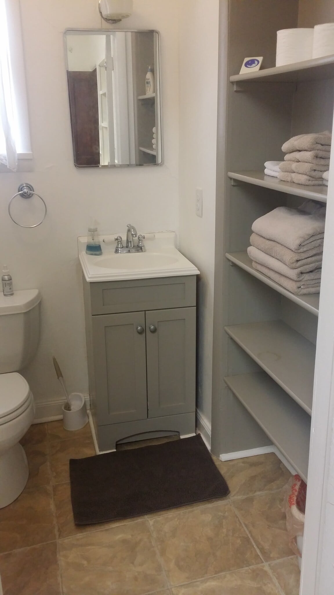 Bathroom with built in storage (towels not included with rental) - 607 Harrison Ave