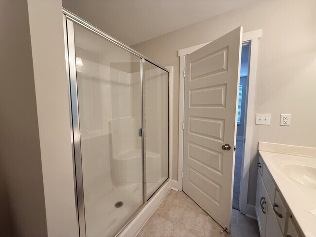 Walk-in shower with glass doors - 3010 Bellflower Cir