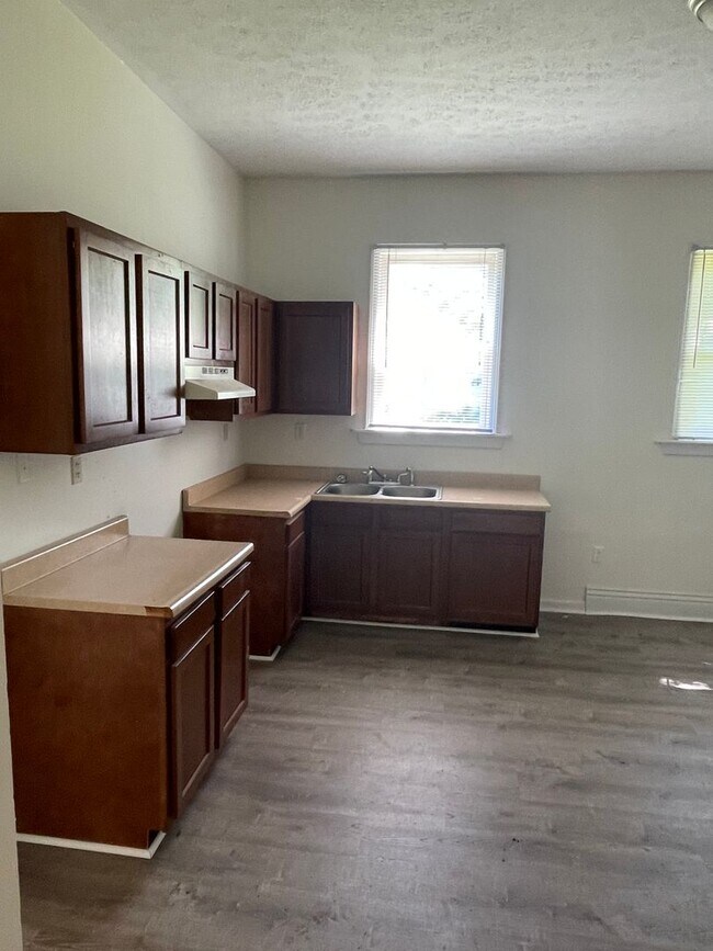 Building Photo - Updated three bedroom two bathroom home in...