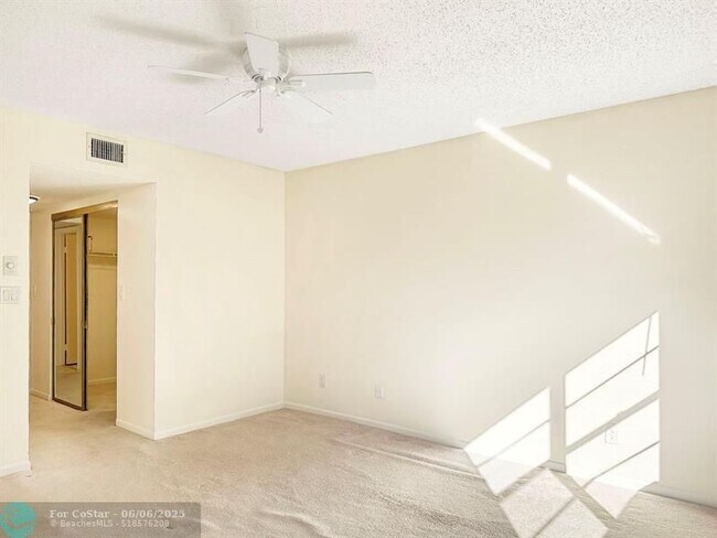 Building Photo - 6090 N Sabal Palm Blvd
