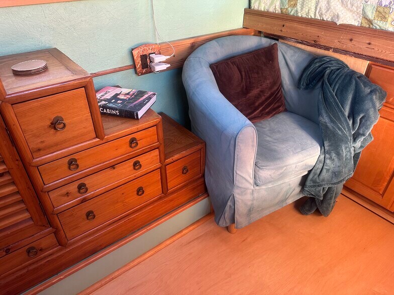 The comfy chair is a great place to cozy up with a blanket and a book! - 833 Valencia St