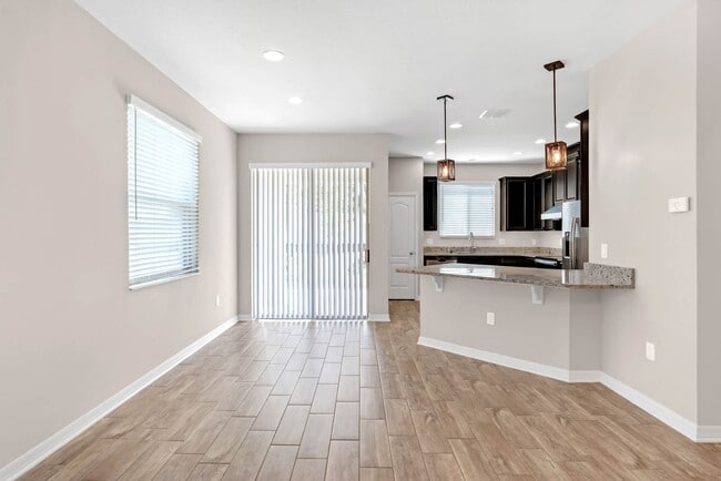 Building Photo - Spacious, Nearly New and Gated 3/2.5/2 Plu...