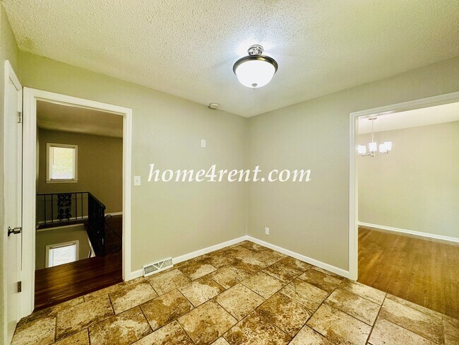 Building Photo - Updated Raytown Ranch w/ Wood Floors, SS Appliances, Finished Basement and a Fenced Yard!