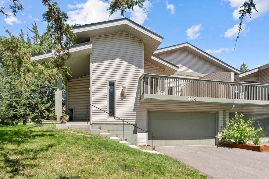 New concrete stairs, handrail, sealed driveway and private entry - 9774 Dorset Ln