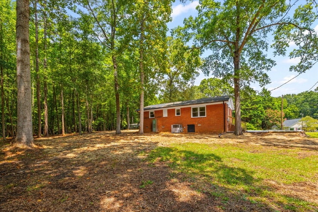 Building Photo - Renovated Brick Ranch with Nature Views + Close to Everything Fort Mill Offers 3 Bedrooms | 1 Bat...
