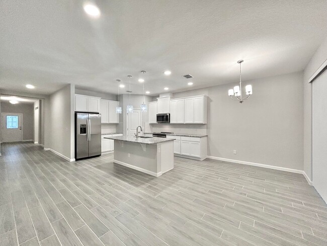 Building Photo - Gorgeous 4/3 Brand New Home with a Spaciou...