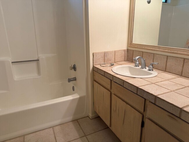 Building Photo - Three bedroom two and a half bath Condo