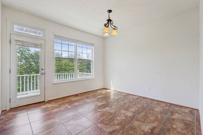 Building Photo - This beautifully maintained end-unit brick...