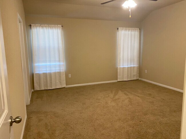 Building Photo - Three Bedroom, Two Bath, Two Car Garage, Washer and Dryer are included.