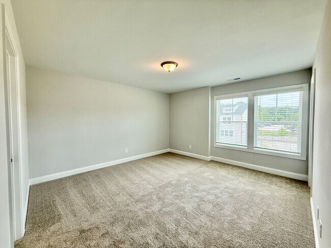 Building Photo - Stunning End Unit New Construction 3BD, 3....