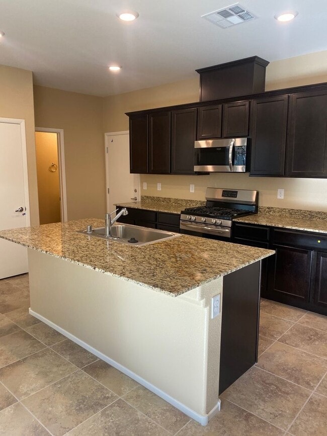 Building Photo - Spacious Townhouse with Loft & Rare 3-Car Garage!