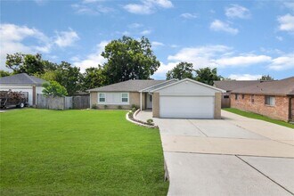 Building Photo - Welcome to this fully remodeled 4/2/2 brick home near Lake Conroe! With new AC/heat, roof, water ...