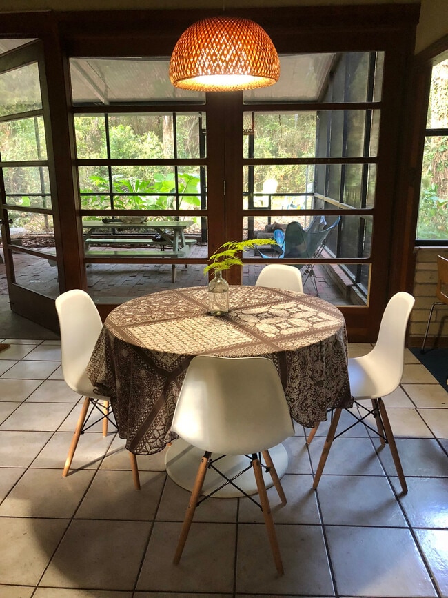 Dining room with floor to ceiling doors and windows - 3812 SW 15th St