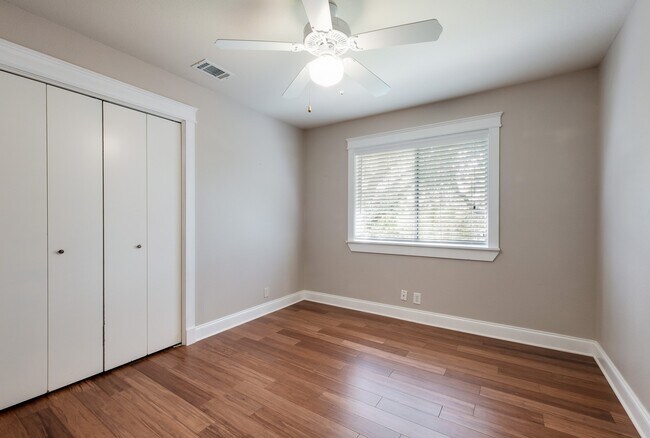 Building Photo - Modern Elegance: 3-Bedroom Townhome with Wood Flooring, Shaded Deck, and Inclusive Amenities