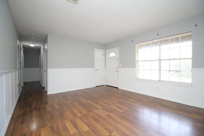 Building Photo - Spacious 3BR/1.5BA Home in Pace with Open Living Area, Tiled Family Room, and Fenced Backyard – M...