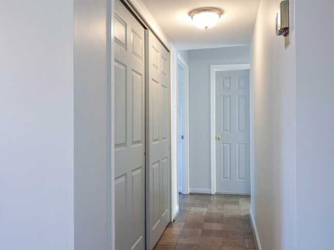 Hallway with coat closets on the left - 702 Quince Orchard Blvd