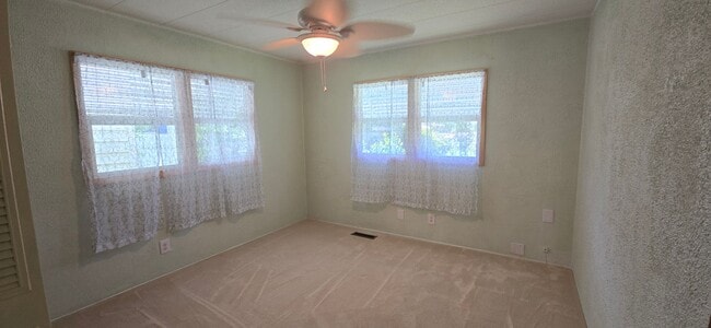 Building Photo - 2 bed 2 baths with carport