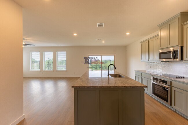 Building Photo - Beautiful 4 Bedroom Home with Covered Patio & Hill Country Views