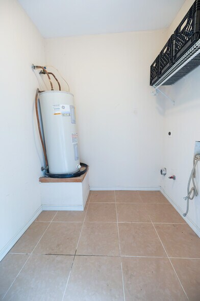 Storage area with washer and dryer hookups - 11609 April Dr