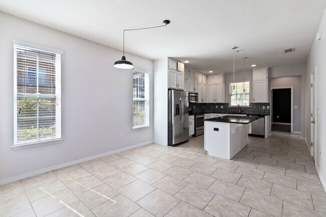 Building Photo - MOVE IN SPECIAL- Beautiful 4/2.5 Townhome For Rent in Harmony