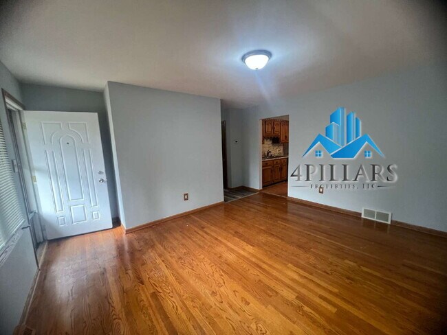 Building Photo - "Charming 3-Bedroom Haven with Finished Basement & Gleaming Hardwood Floors in Hammond!"