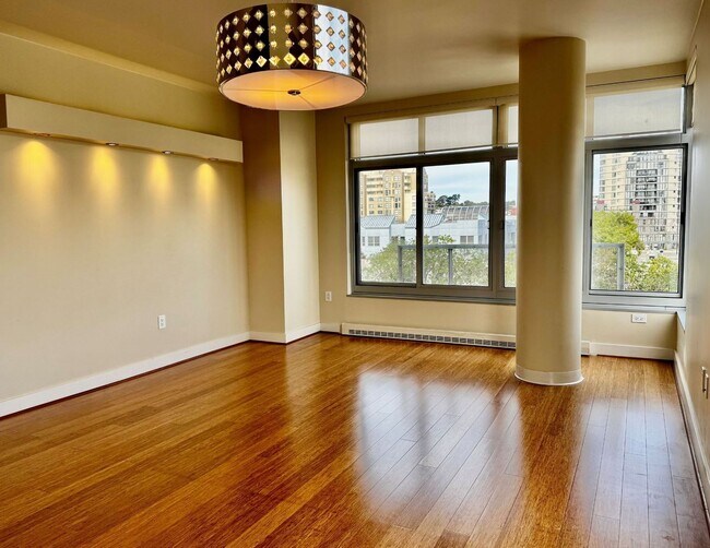 Building Photo - Corner Light. City Energy. Zero Compromise.