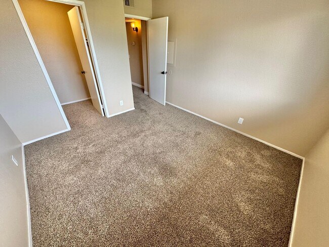 Building Photo - THIS SECOND-FLOOR DESERT SHORES CONDO OFFE...