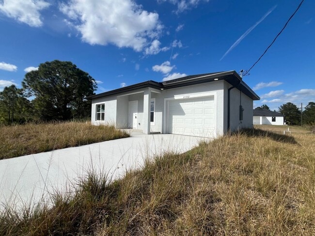 Building Photo - Brand-New Modern 2BR/2BA Home with Garage – Quiet West Lehigh Location