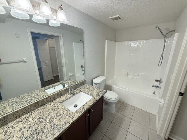 Building Photo - FIRST-FLOOR 3 BEDROOM CONDO IN VILLAGES OF BLOOMINGDALE!