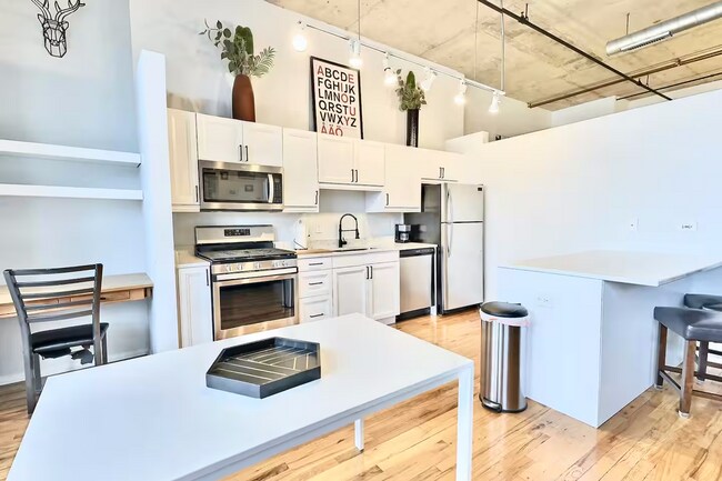 Kitchen with nook, table, and island - 6 S Laflin St