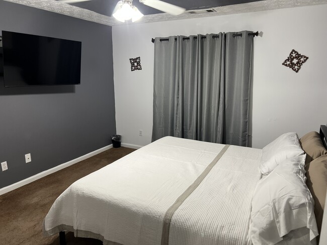 King bed with television - 105 Mills Lndg