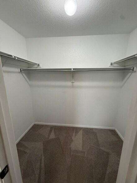Primary bedroom walk-in closet - 5074 W Claxton Circle
