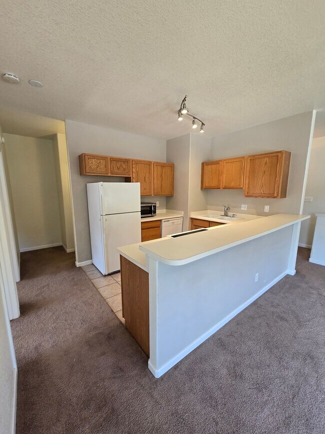 Building Photo - Spacious Townhome with Oversized 2-Car Gar...